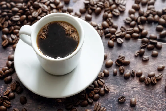 ingest two or three glasses of coffee daily? According to a study, you may live longer, especially if it's on the ground.