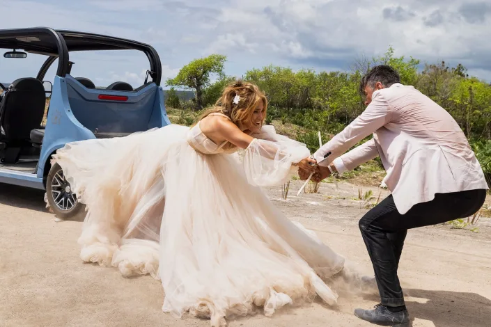 In the newest Shotgun Wedding clip, Josh Duhamel and Jennifer Lopez literally say "till death do us part."