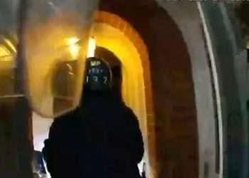 Terrifying moment cops are shot at by armed thug during dramatic raid of house