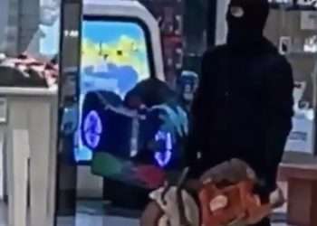 Shock moment robber brandishes circular saw in shopping centre after masked gang storm jewellery stores