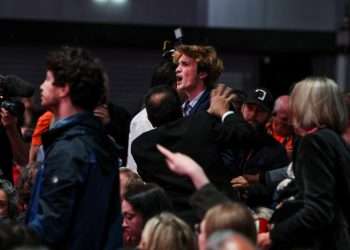 Moment anti-Israel protester who heckled Rachel Reeves is dragged out of party conference as crowd cheers