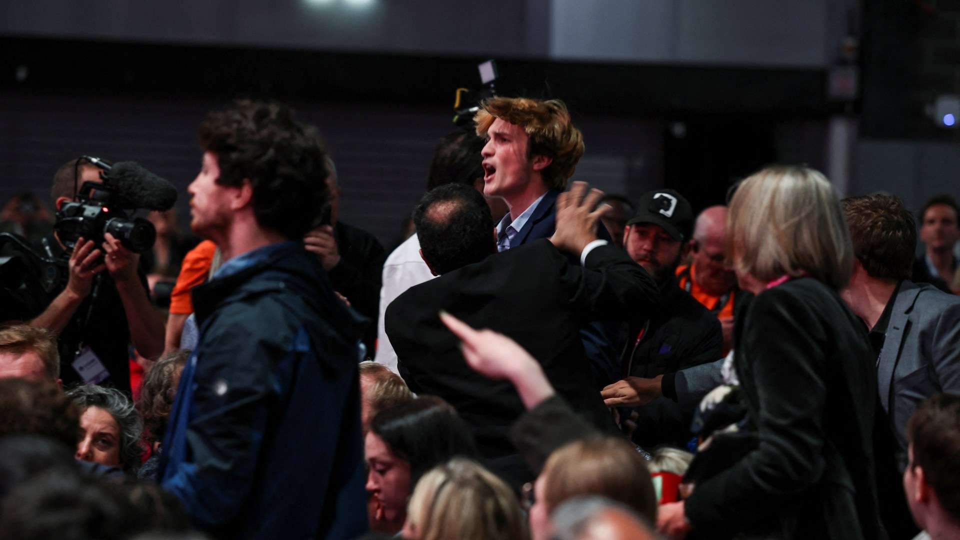 Moment anti-Israel protester who heckled Rachel Reeves is dragged out of party conference as crowd cheers