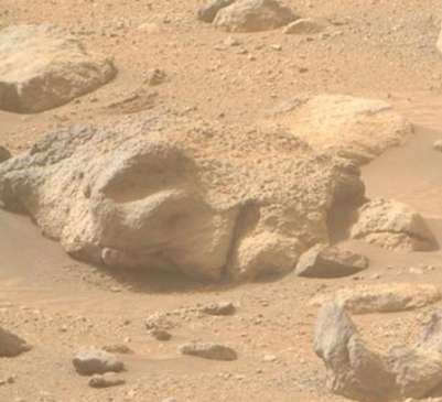 Eerie ‘human face’ found buried in sand on Mars in latest mysterious discovery on Red Planet