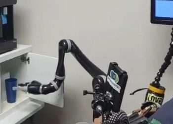 Remarkable video shows paralysed man control a robotic arm using only his MIND in groundbreaking record
