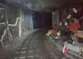 Inside gloomy tunnels of abandoned UK theme park with creepy bunny statues that look straight out of a horror film