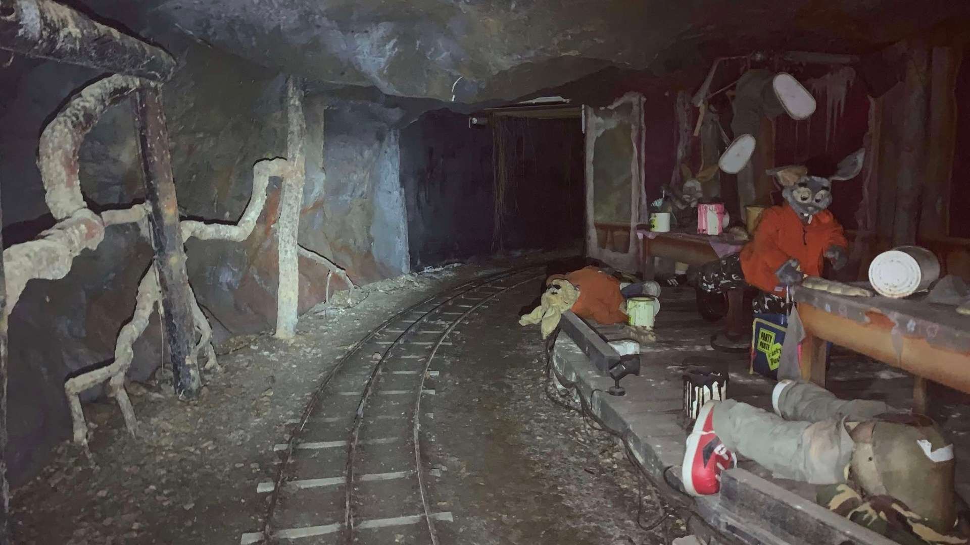 Inside gloomy tunnels of abandoned UK theme park with creepy bunny statues that look straight out of a horror film