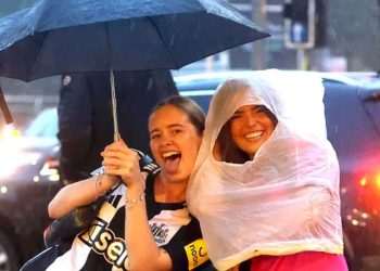 UK weather: Revellers get drenched on Leeds’ Otley Run as heavy rain blasts country with 40 flood warnings & 75mph winds